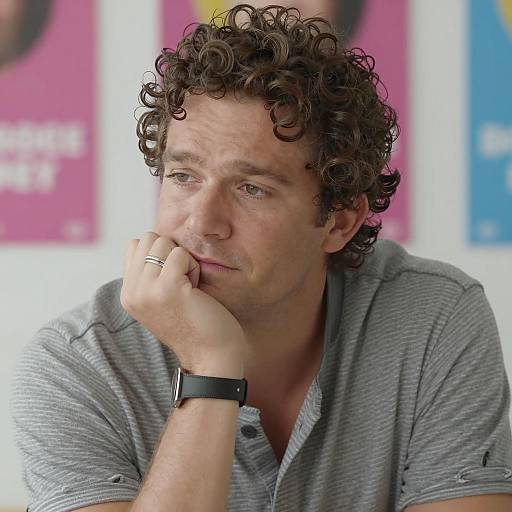 Thoughtful Man in Striped Shirt