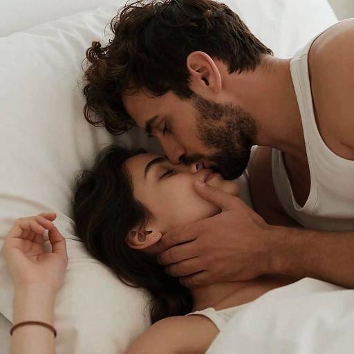 Intimate Moment Between Couple in Bed