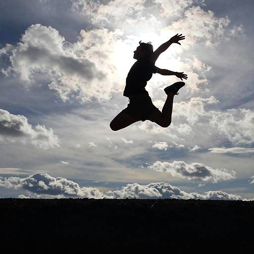 Dramatic Silhouetted Mid-Air Jump