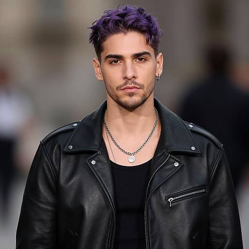Photograph of a young man with purple hair, black leather jacket, black shirt, silver necklace, and ear piercing, walking confidently on a blurred city