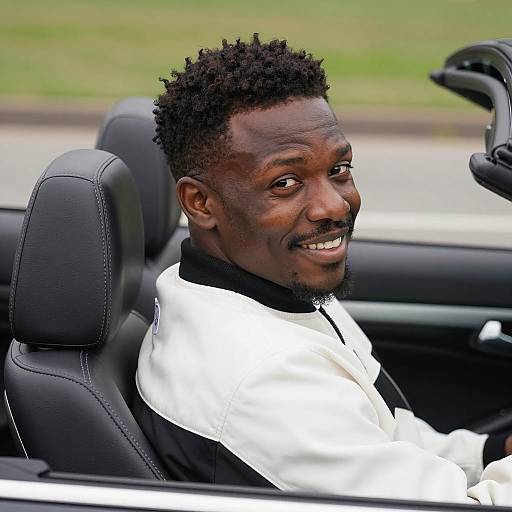 Smiling Man in Convertible Car