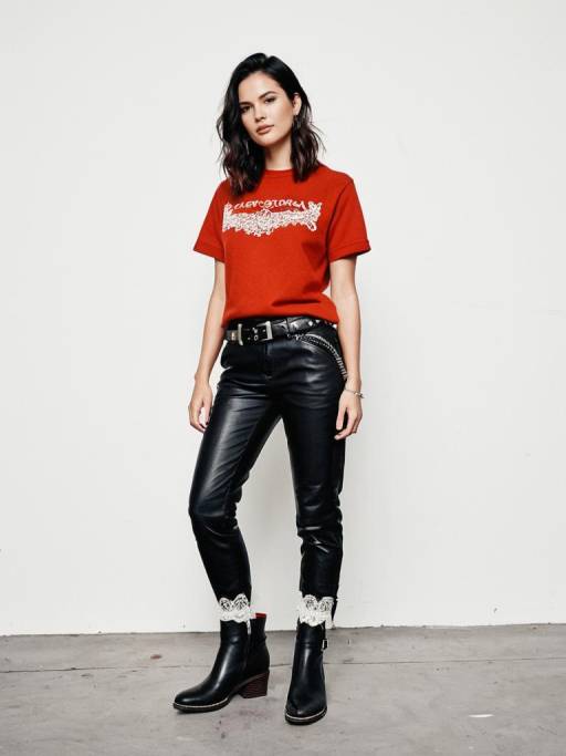 Woman in Red Graphic Sweatshirt and Black Leather Pants
