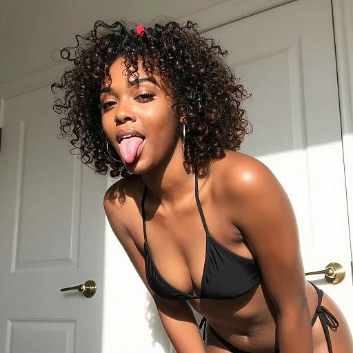 African American Woman in Black Bikini Tongue Out
