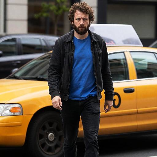 Rugged Man in Urban Setting with Taxi