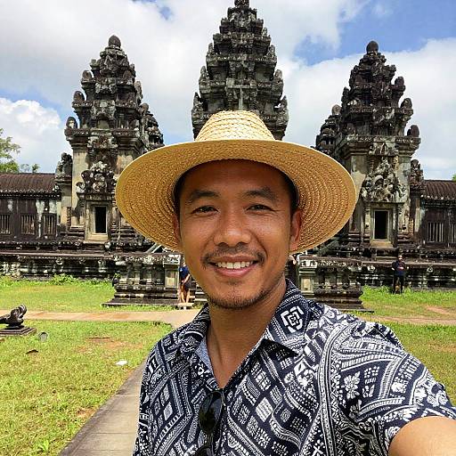 Smiling Man Taking Selfie at Ancient Stone Temple