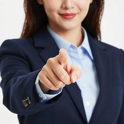 Businesswoman Pointing At Camera