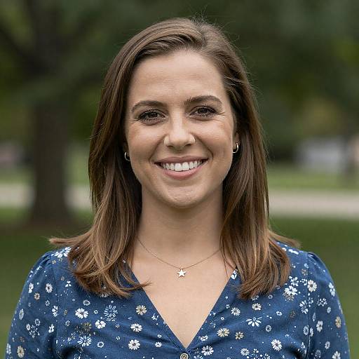 Smiling Woman in Blue Floral Blouse