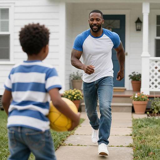 Man Running Toward Boy with Ball