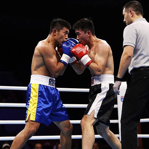Intense Boxing Match Under Dim Lights
