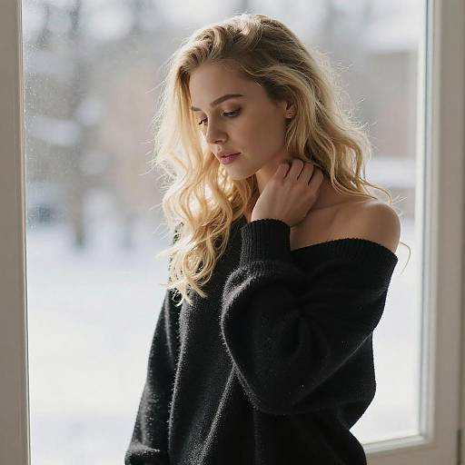 Blonde Woman in Knit Sweater by Window