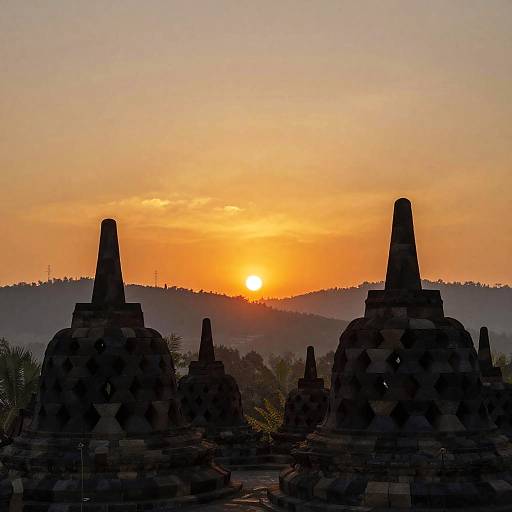 Sunset Silhouettes Over Temple Landscape