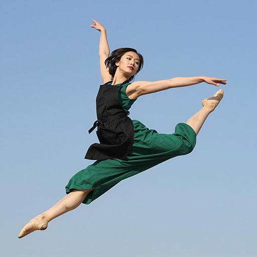 Elegant Leap of a Woman in Green