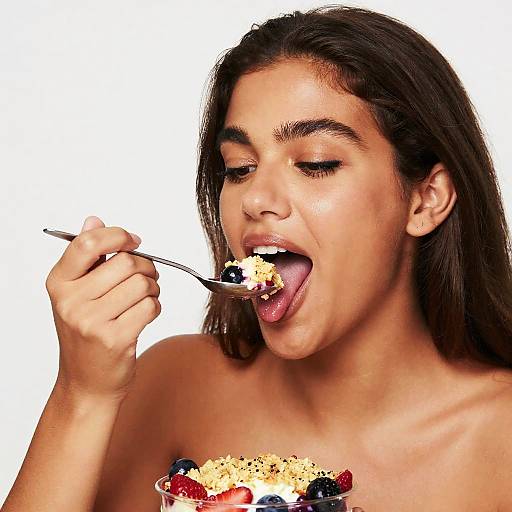 Young Woman Enjoying Fruit Crumble