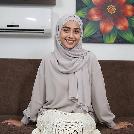 Smiling Woman in Gray Hijab Indoors