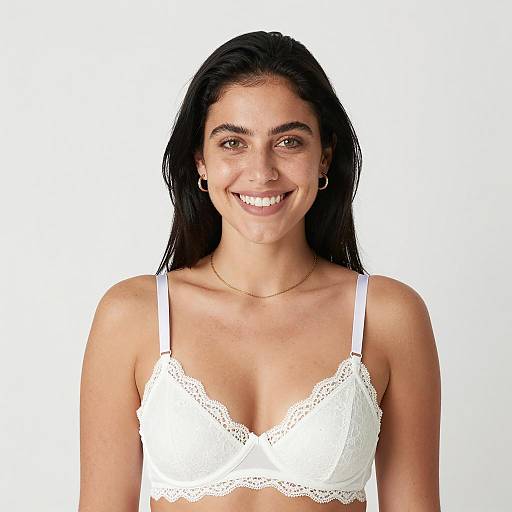 Smiling woman in white lace bra