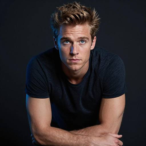 Young Man Leaning Forward with Intense Gaze