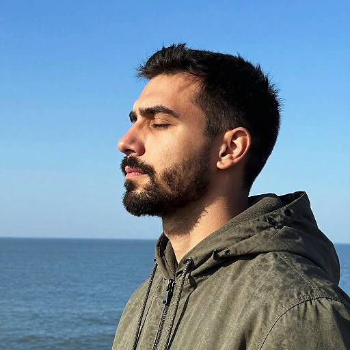 Hooded Man Profile by the Ocean