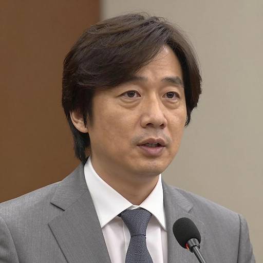 Focused Speaker in Stylish Suit