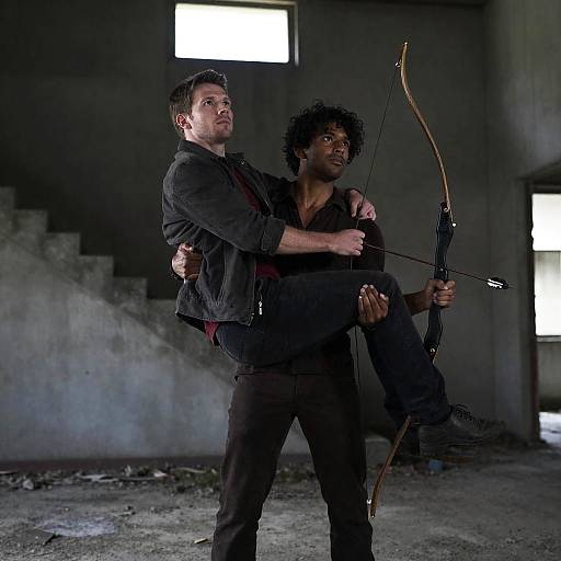 Two Men in Abandoned Building with Bow and Arrow