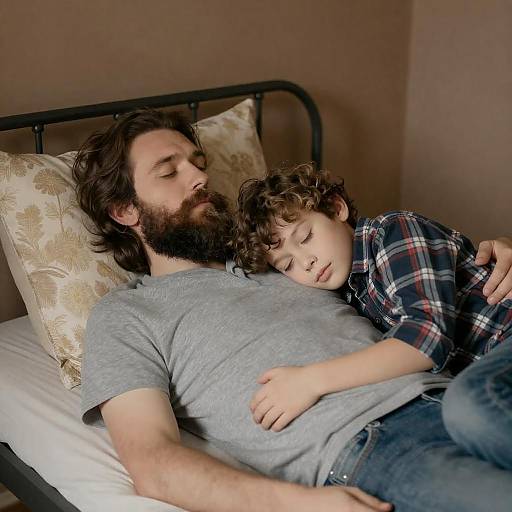 Father and Son Resting Together on Bed