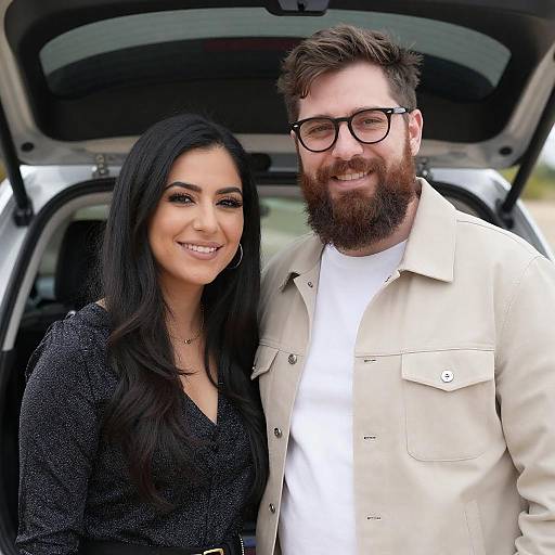 Smiling Couple by Open Car Trunk