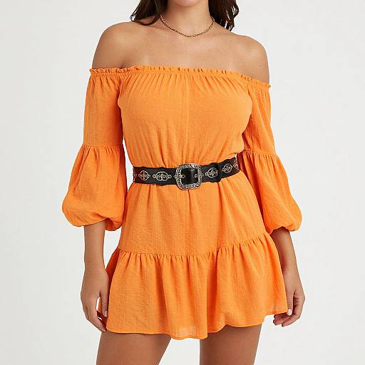 Photograph of a woman wearing an off-shoulder, bright orange, ruffled dress with puffed sleeves, black belt with floral buckle, and