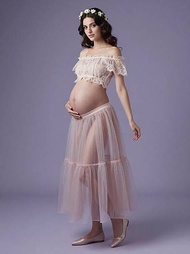 Pregnant Woman in Ethereal Maternity Outfit