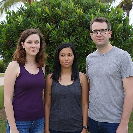 Three People Standing Outdoors by Tropical Bush
