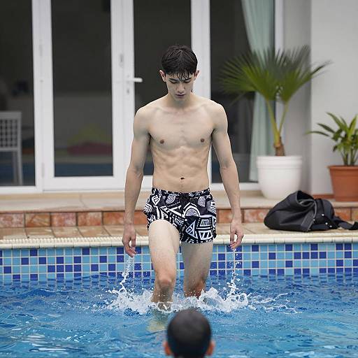 Young Man Splashing in a Pool Scene