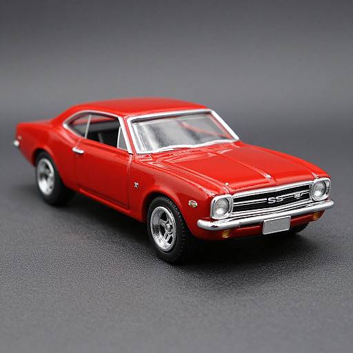 Photograph of a detailed, bright red, vintage muscle car with chrome accents, white roof, and shiny silver wheels on a gray textured background.