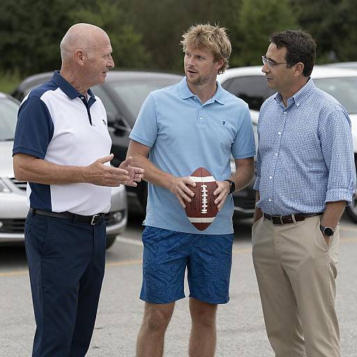 Three Men Outdoors With a Football