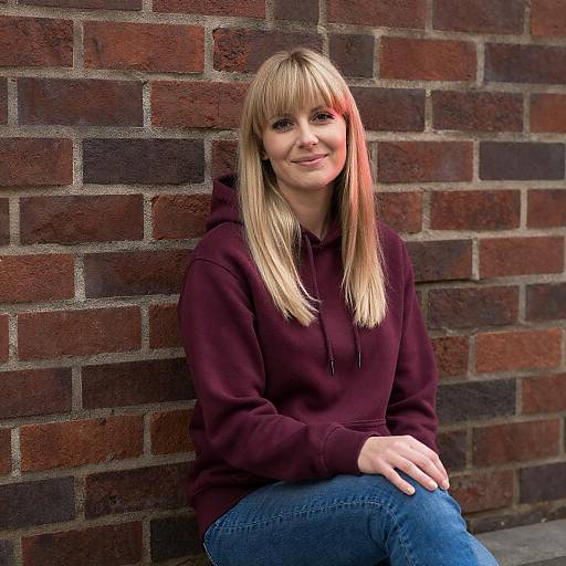 Blonde Woman in Maroon Hoodie Pose