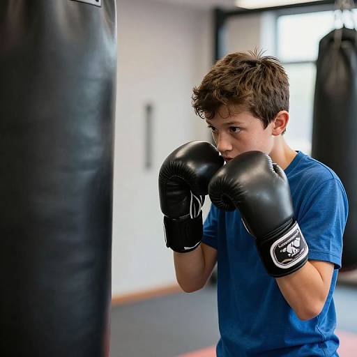 Boy Training with Boxing Gloves