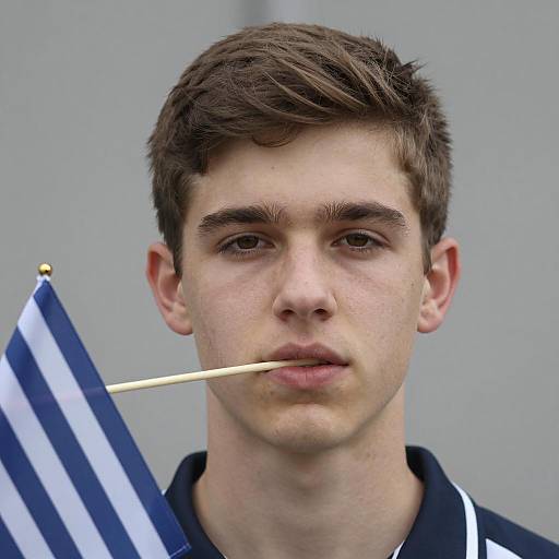 Youthful Male with Flag and Neutral Look