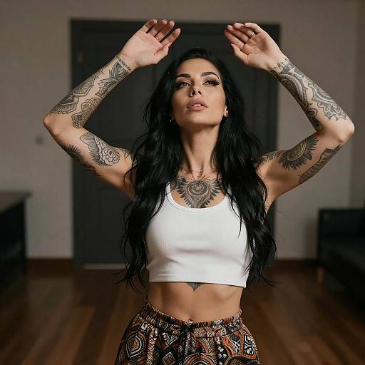 Tattooed Woman in Dim Room