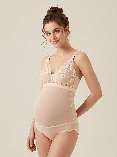 Pregnant Woman in Soft Blush Maternity Lingerie