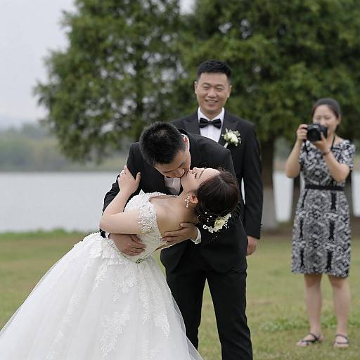 Lakeside Wedding Kiss with Guests