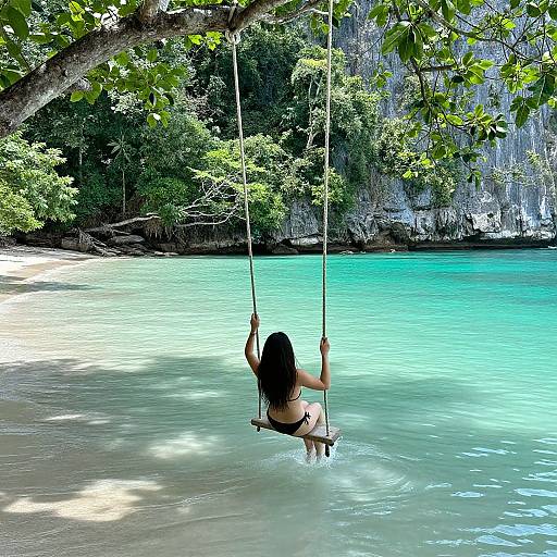 Woman Swinging Over Turquoise Waters