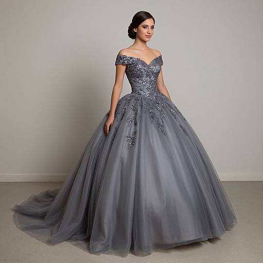Photograph of a fair-skinned woman with dark hair in an elegant, off-the-shoulder, blue-gray, full-skirted gown with
