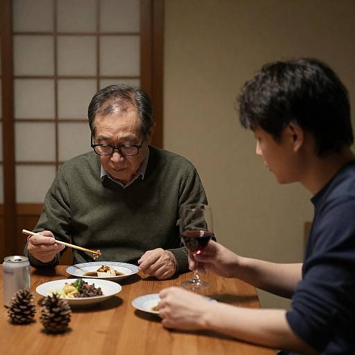 Older and Younger Asian Men Dining