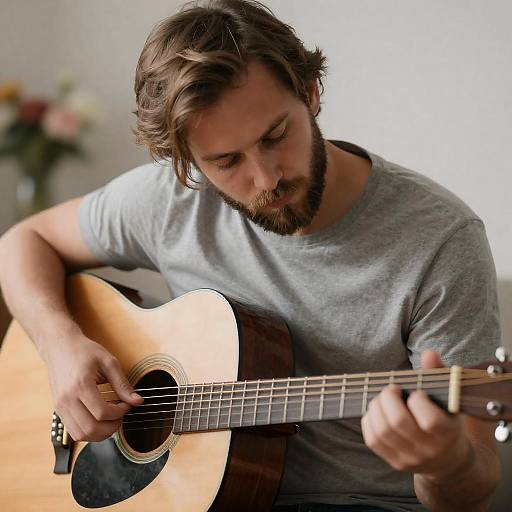 Focused Man Playing Acoustic Guitar Portrait