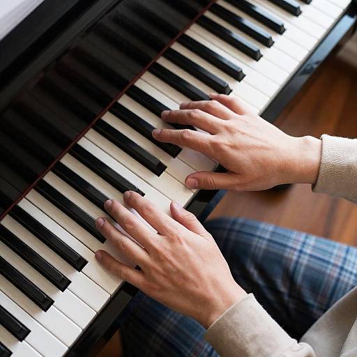 Elegant Hands Playing Piano from Above