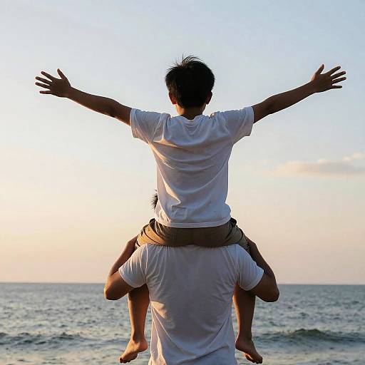 Boy on Shoulders at the Beach at Sunset