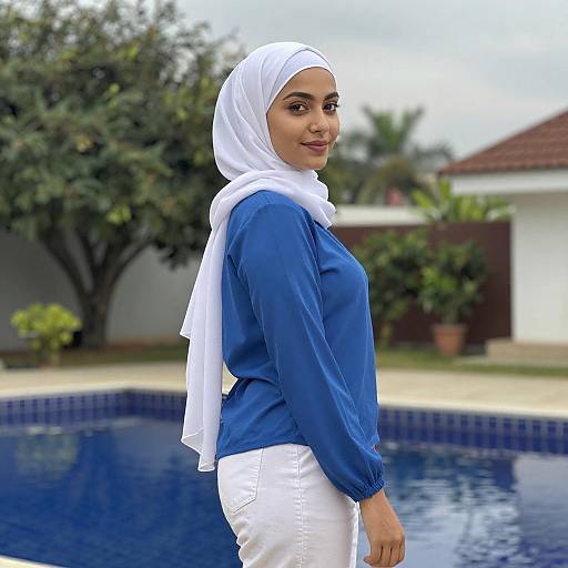 Young Woman by Blue-Tiled Pool