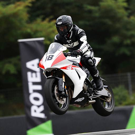 Dynamic Motorcycle Jump in Black and White