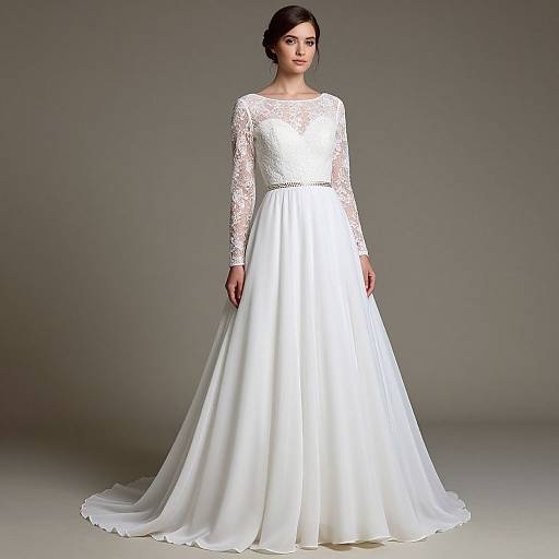 Photograph of a fair-skinned woman with dark hair, wearing a white, lace long-sleeve wedding dress with a flowing skirt, standing against