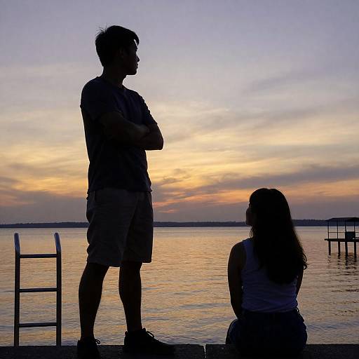 Silhouetted Couple at Sunset Lake