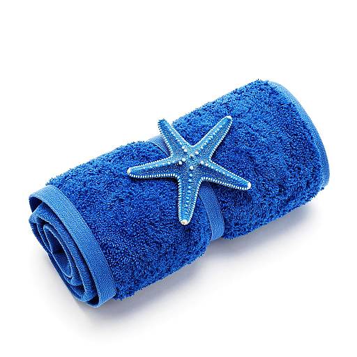 Photograph of a blue, textured towel roll adorned with a sparkling, silver starfish, set against a stark white background.