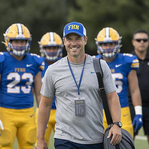 Cheerful Football Coach with Players