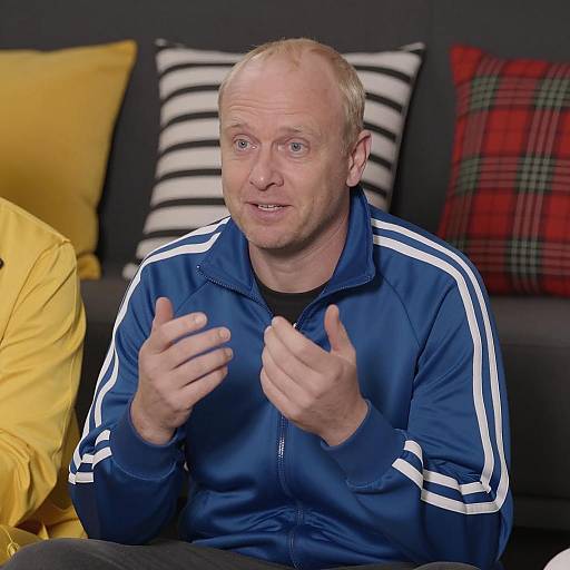 Man in Dark Room with Striped Cushions